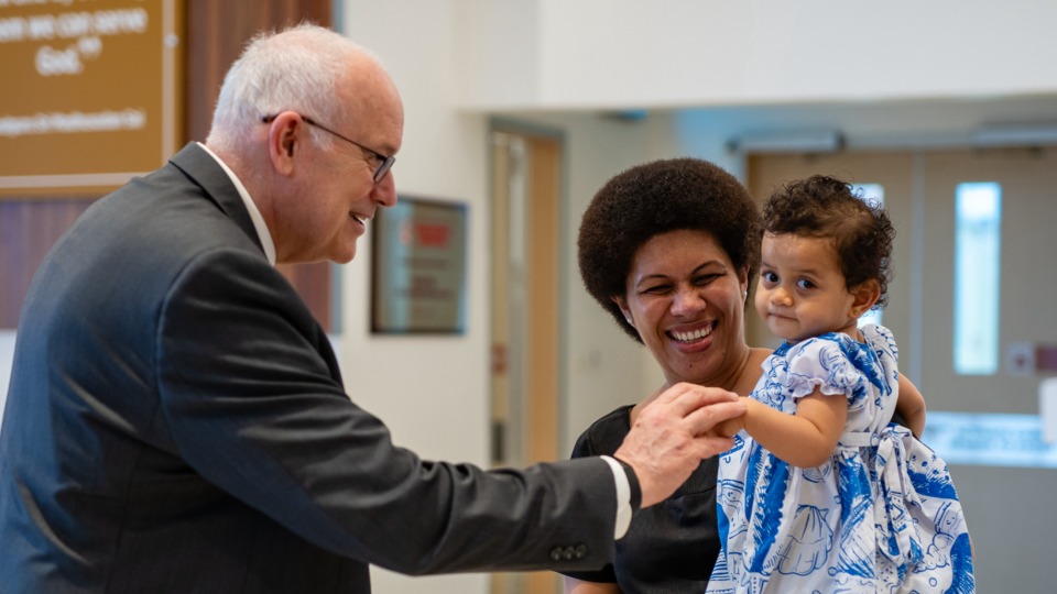 Elder Paul V. Johnson greets Naomi and her daughter, Makereta, in Suva, Fiji. 25 March 2024. 
